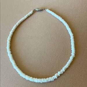 16” puka shell necklace in excellent condition.  Very uniform in size/color.